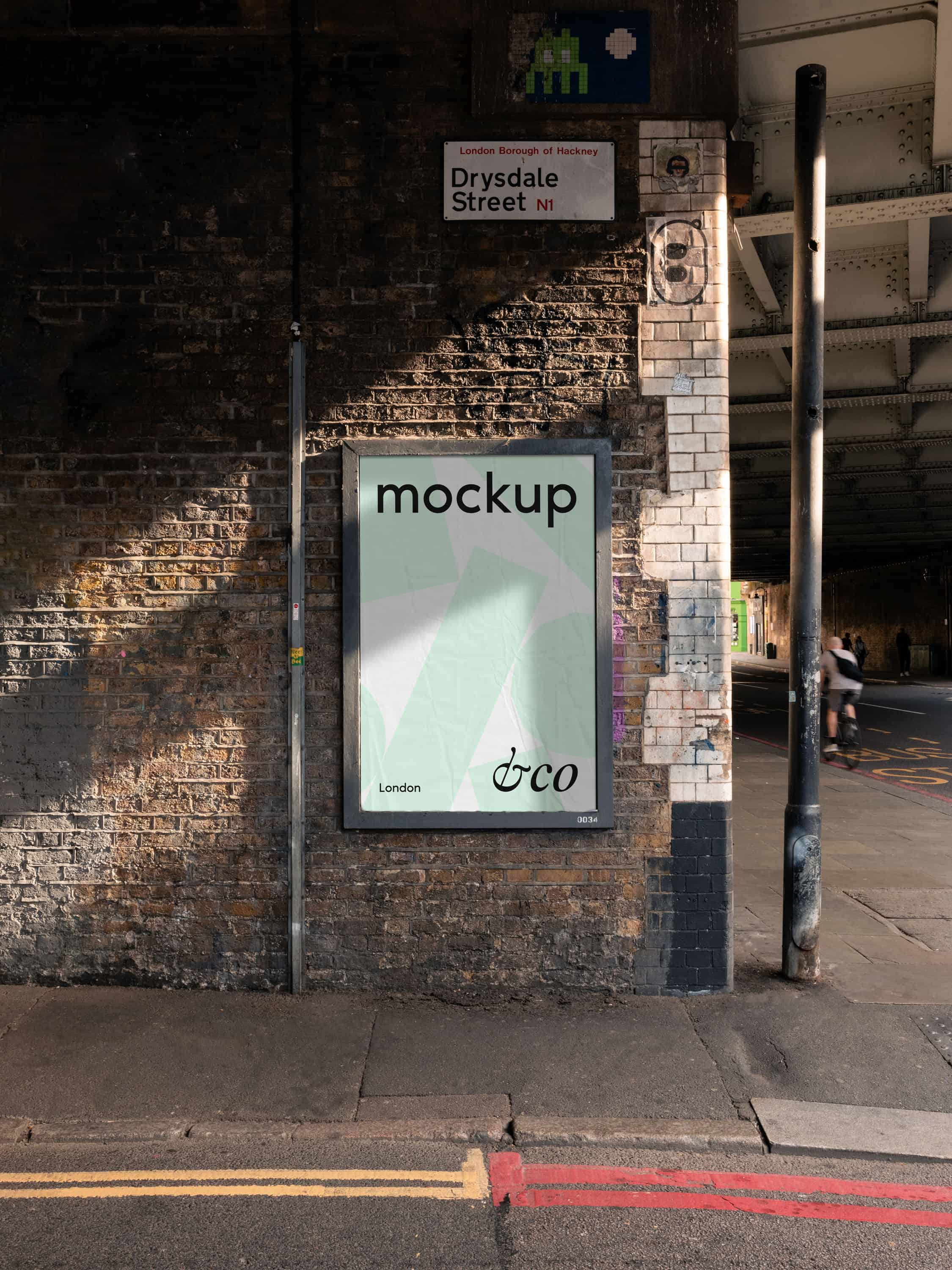 East London city poster mockup captured on the side of a road, customisable for showcasing street art, urban designs, and advertising projects