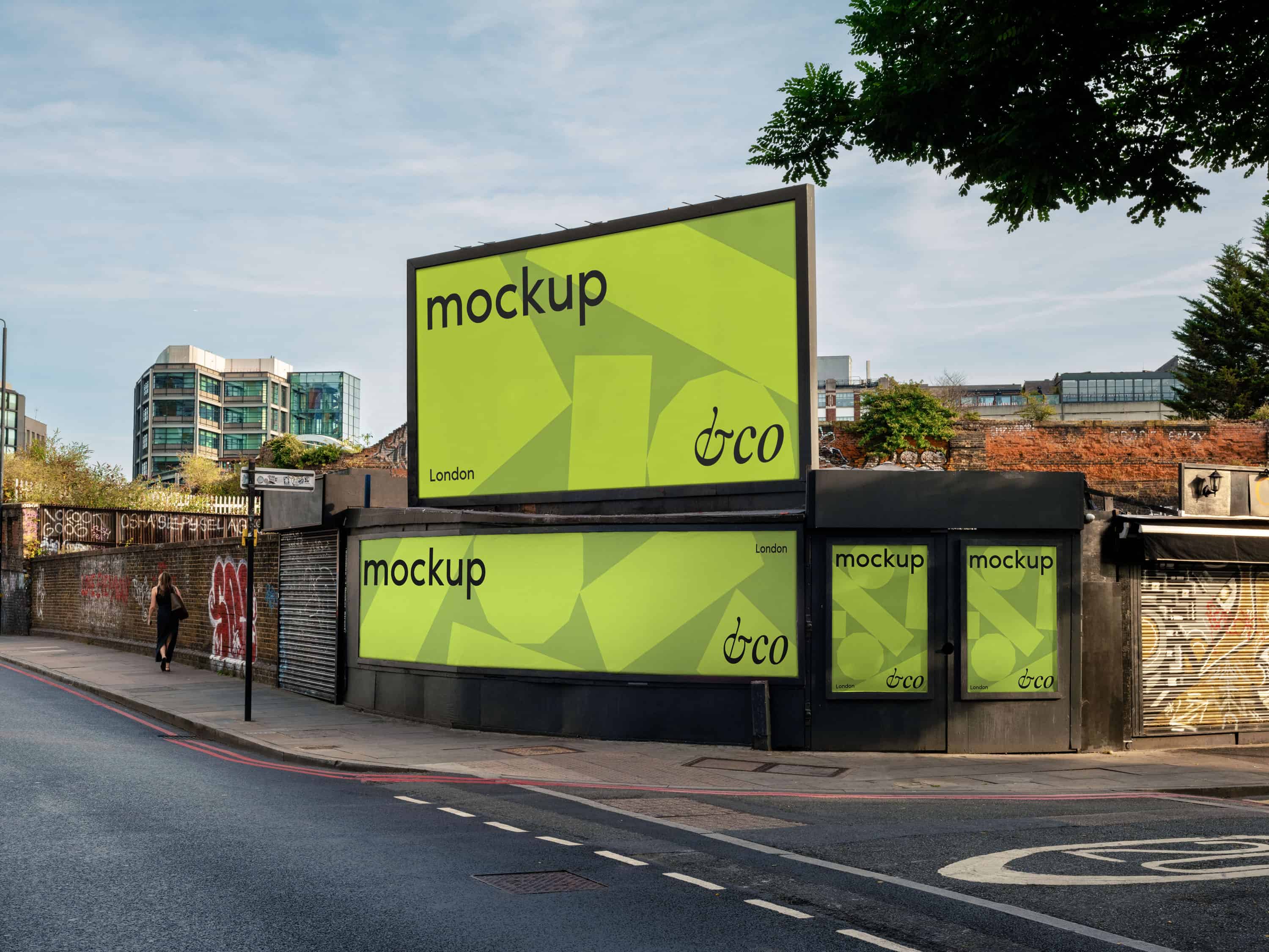 Mockup of four billboards at a street corner in Hackney, two landscape and two portrait, featuring advertising designs in an urban environment.